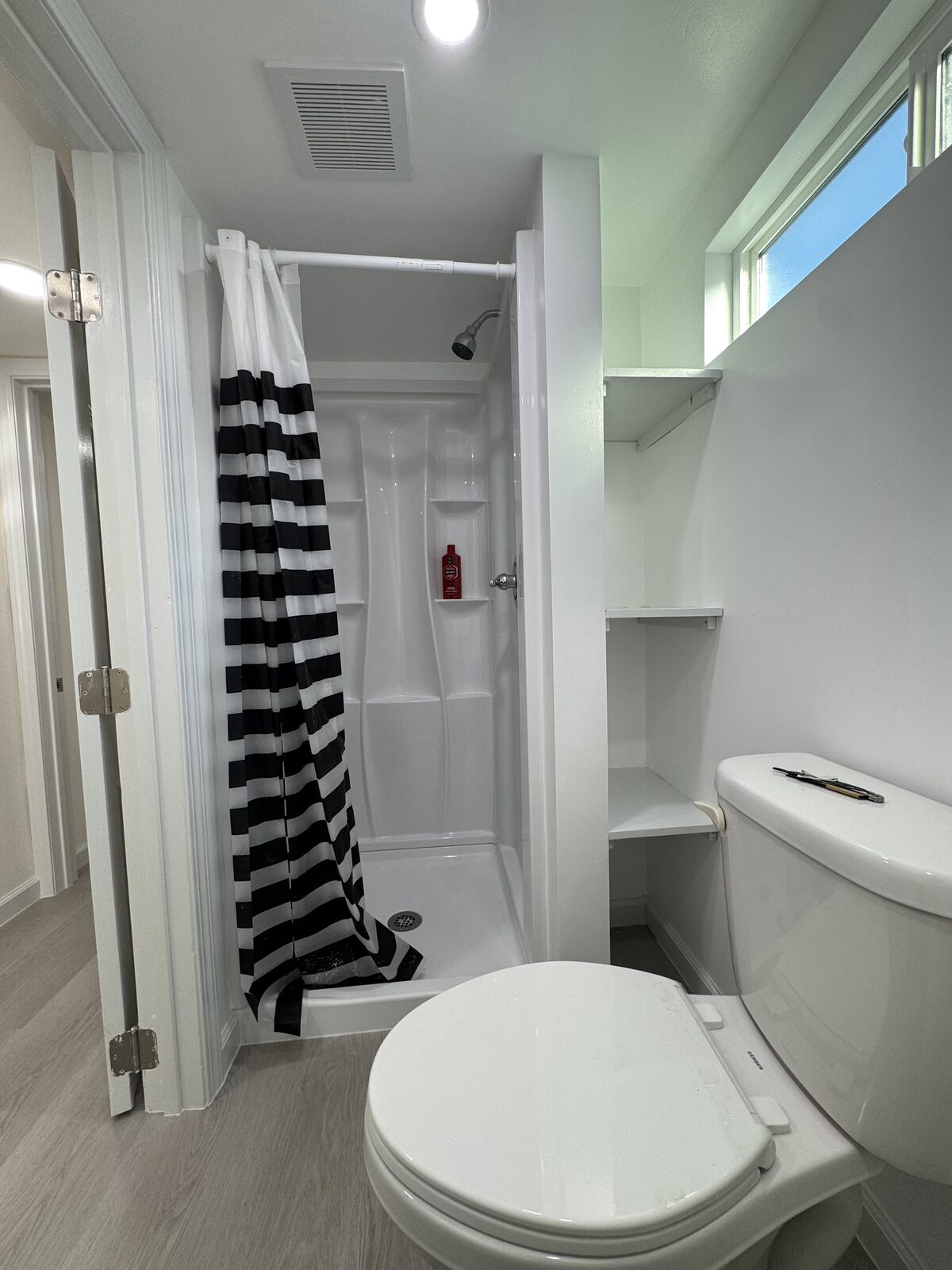 New bathroom with shower and fixtures